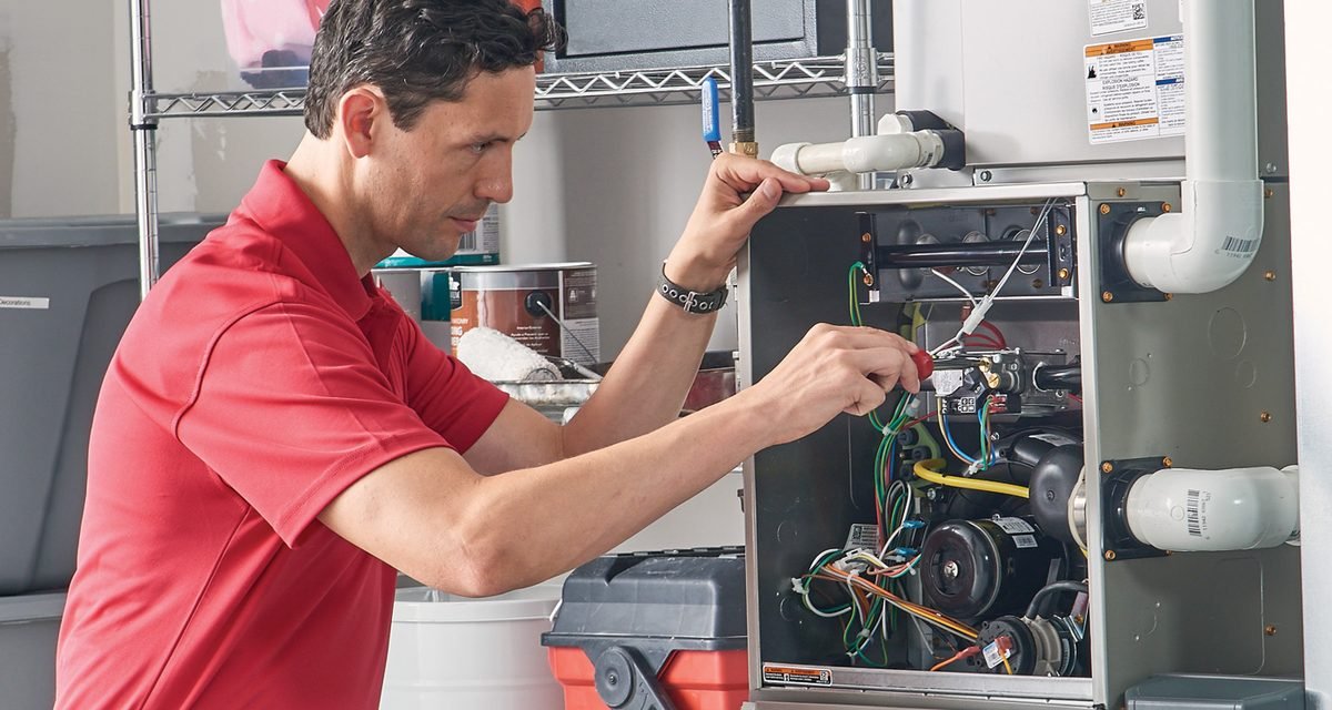 Technician repairing a furnace